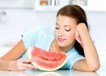 A girl follows a watermelon diet to combat excess weight. 